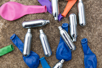 Nitrous oxide metal bulbs or laughing gas recreational drug use - obrazy, fototapety, plakaty