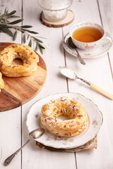 Small pastry Paris Brest in an old plate