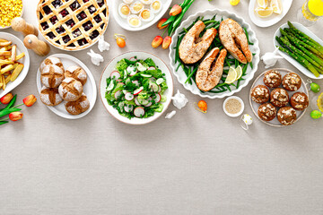 Fototapeta na wymiar Easter festive table with salmon, asparagus, salad, potato, muffins and berry pie