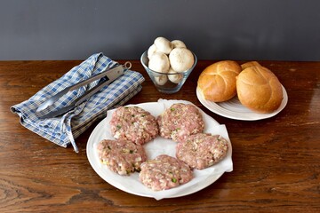 Ingredients ready for preparing homemade hamburgers for summer grilling and picnics. Photo concept food, background, lifestyle. Flat lay copy space. 