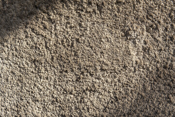 warm limestone texture. gray concrete wall with rough texture.