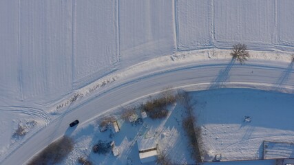 winter road top view. long turn a smooth turn on a slippery snowy road. dangerous road icy. aerial view 