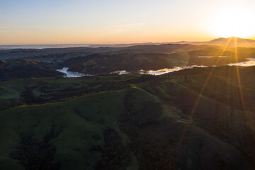 A brilliant sunrise greets the hills of the East Bay, not far from San Francisco Bay in California.