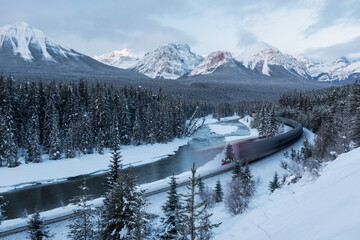 The Canadian Pacific Railway train whooshes by at Sunrise from Morants Curve.