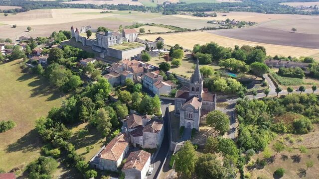 General summer view of picturesque French settlement of Villebois-Lavalette in Charente department looking out over chateau of Roman times