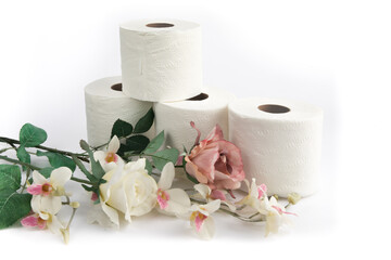 rolls of toilet paper with fabric flowers on a white background
