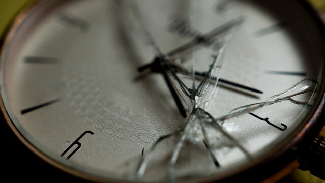 Old watch with broken glass. broken clock. concept of time.