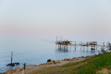 Traditional wooden fishing house in the sea in Italy