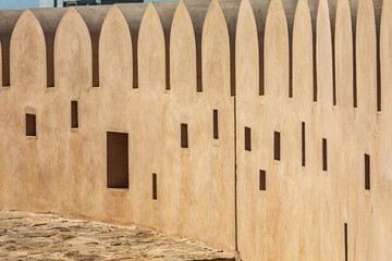 Crenulated wall in Sur, Oman.