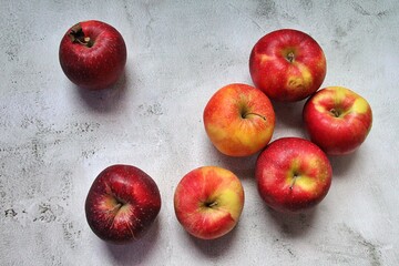 stacked colored apples, fresh fruit full of juice, red and yellow apples, fruit full of vitamins