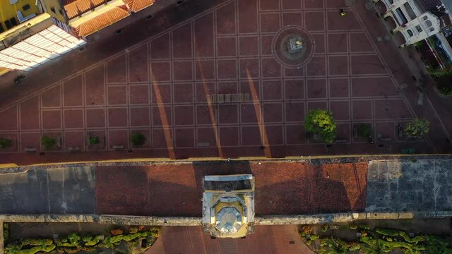 Torre del Reloj at sunrise traveling in Cartagena de Indias, Colombia  - Drone view footage 