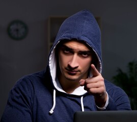Hacker hacking the data late at night