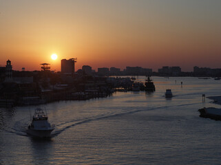 Charter Fishing Boats leaving Destin Harbor at Dawn