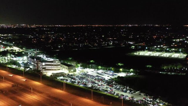 Slow Night Aerial Panoramic Of Traffic Flowing Along The Interstate Brightly Lit Local Businesses Weston, Florida