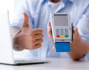 Man processing credit card transaction with POS terminal