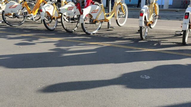 Hyper lapse Milan bikes, passersby on foot - 4k resolution video of Milan rental bikes with people passing