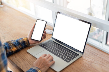 computer screen,cell phone blank mockup.hand woman work using laptop texting mobile.white background for advertising,contact business search information on desk in cafe.marketing,design