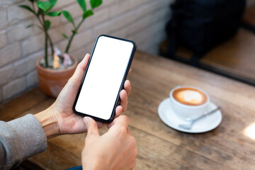 cell phone blank white screen mockup.woman hand holding texting using mobile on desk at office.background empty space for advertise.work people contact marketing business,technology
