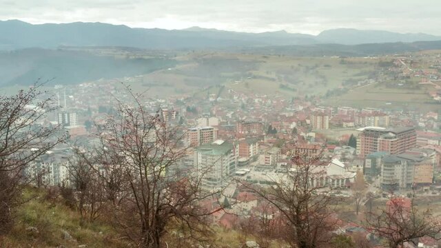 Tutin town in Serbia valley, view from top of surrounding mountains, aerial view
