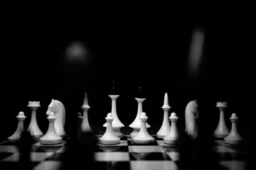 black and white chess on chessboard black and white photo