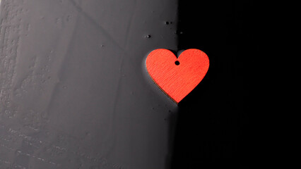 Valentine's day concept. Handmade red hearts on a dark background. With place for your text.