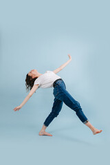 Flexible contemporary dancer walks with straight legs, bent back at right angle