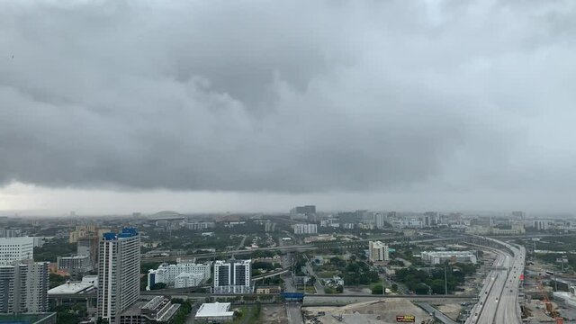 Storm clouds approaching a city. Hyper lapse of storm clouds in a city.