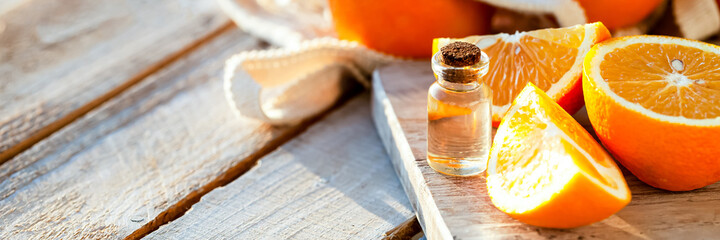 Concept of natural organic orange essential oil for skin face and body care. Moisturizing,...