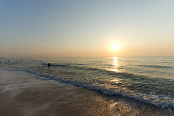 Fototapeta na wymiar waves on the beach at sunrise Cha-am Phetchaburi near Bangkok, Thailand