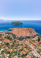 Naklejka premium Aerial drone shot of Otok Lokrum in Adriatic sea near Dubrovnik old town in Croatia summer noon