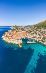 Aerial drone shot of Old Port in Dubrovnik old town in Croatia summer morning