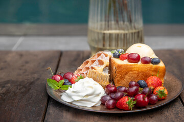 Healthy breakfast or morning snack with  fruits and berries, vegetarian food, diet and health concept