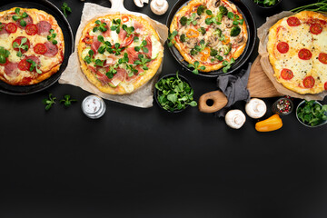 Delicious fresh pizzas variety with different souces and vegetables. Homemade food concept.