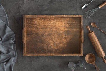 Empty wooden crate and bakery utensils on a Concrete background, Free space for your text