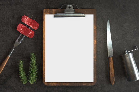 Menu Mockup With Knife And Fork On A Concrete Background, Free Space For Your Text