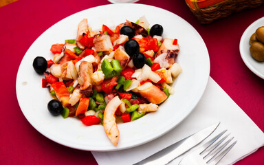 Delicious cold salad from variety of seafood with chopped vegetables (Salpicon de mariscos) typical for Spanish cuisine