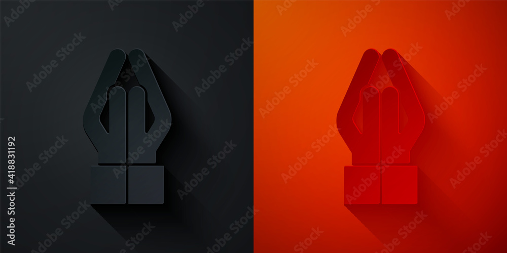 Wall mural Paper cut Hands in praying position icon isolated on black and red background. Prayer to god with faith and hope. Paper art style. Vector.