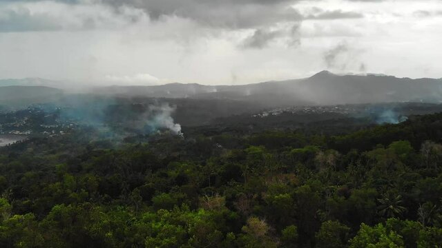 Mayotte island after the storm. Heavy clouds with smoke from a bonfire. #2
