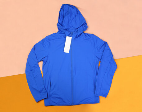Blue hood wind jacket on passtel background