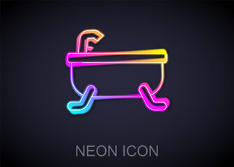 Glowing neon line Bathtub icon isolated on black background. Vector.