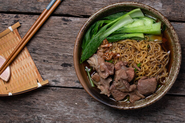 Egg Noodle Noodles with Stewed Pork and Vegetables on Wooden Floor Thai Food