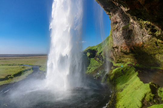 Beautiful Seljalandsfoss waterfall in Iceland, icelandic summer nature and river landscape © Iuliia Sokolovska