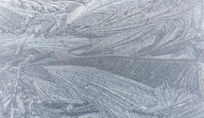 Patterns of Ice on a Frozen Window on a Winter Day