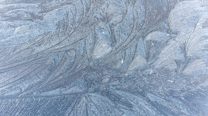 Patterns of Ice on a Frozen Window on a Winter Day