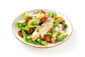 Caesar salad with grilled chicken meat, romaine leaves and Parmesan cheese on a white background