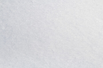 Winter snow. Snow texture Top view of the snow. Texture for design. Snowy white texture. Snowflakes.