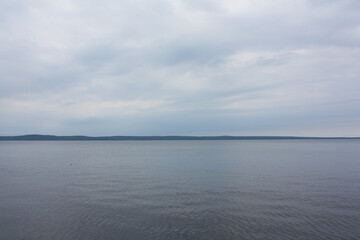 Blue sea or ocean water surface, underwater with sunny and cloudy sky