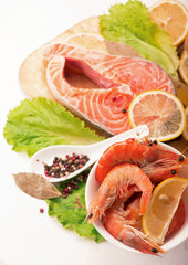 Fresh salmon steak filet, ginger, lemon, soy sause and chopsticks