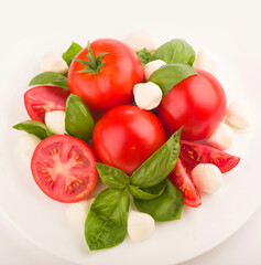 mozzarella, cherry tomatoes and fresh basil - ingredients for caprese salad