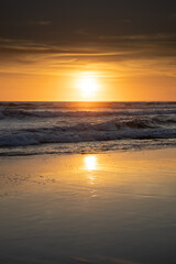 Sunset and beach. Seascape background. Bright sunlight. Sun at horizon line. Scenic view. Sunset golden hour. Sunlight reflection in water. Magnificent scenery. Copy space. Bali